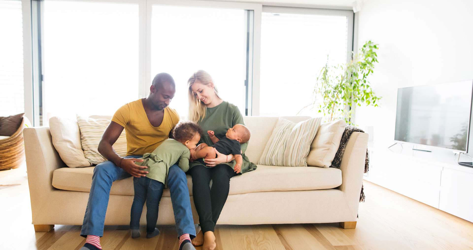 Family sitting on the couch together