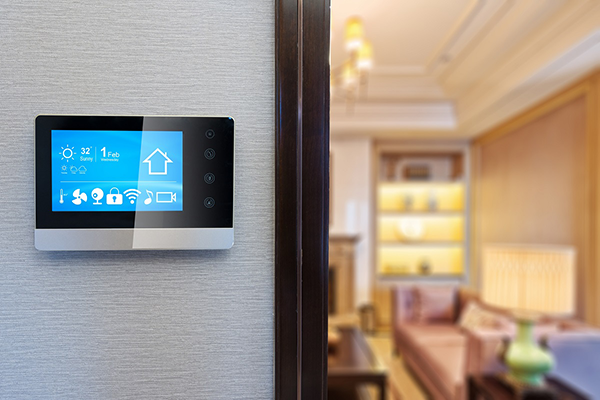 Picture of a smart thermostat on a wall in a house